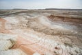 Hills of chalk and limestone and slopes of multi-colored mountains with weathering and washouts from water Royalty Free Stock Photo