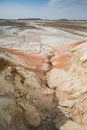 Hills of chalk and limestone and slopes of multi-colored mountains with weathering and washouts from water Royalty Free Stock Photo