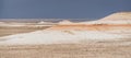 Hills of chalk and limestone and slopes of multi-colored mountains with weathering and washouts from water Royalty Free Stock Photo