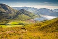 Hills and mountains under the beautiful light from within the clouds and the green hills West Highlands in Scotland, United