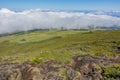 Hills at the Pico volcano, Azores, Portugal with the clouds in the background Royalty Free Stock Photo