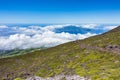 Hills at the Pico volcano, Azores, Portugal with the clouds in the background Royalty Free Stock Photo