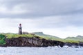 Hills of Sabtang Island with Lighthouse fronting the shore at, Batanes, Philippines Royalty Free Stock Photo