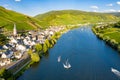 Hills with vineyards and church in Merl village of Zell Mosel town, Rhineland-Palatinate, Germany. Water skiing, barges Royalty Free Stock Photo