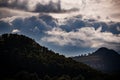 The hills of Xeraco under iridescent clouds Royalty Free Stock Photo