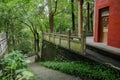 Hillside ancient Chinese building and steps in summer woods