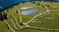 Hillside landscape featuring a large array of solar panels situated in an alpine Royalty Free Stock Photo