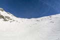 Hillside running over the mountain skiers.