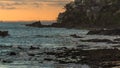 Hillside with several houses by the sea on the beautiful Rio Vermelho beach during Por do Sol in Salvador, Brazil