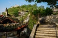 Hillside stairway and tile-roofed buildings in sunny morning