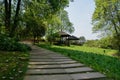 Hillside summer houses by flagstone path at sunny spring noon Royalty Free Stock Photo