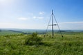 A hilltop triangulation map point. Landscape of countryside view