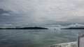 The hilly coast of Kamchatka and the ship in the distance