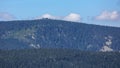 Hilly forested landscape with rock formation on the top of a ridge - Vozka mountain Royalty Free Stock Photo