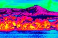 Hilly landscape, forest with colorful thermal camera display