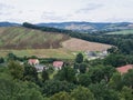 Hilly landscape with houses, field and trees in Silesia, Poland