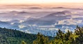 Hilly landscape in the mist under Jested Mountain. Weather temperature inversion, Czech Republic Royalty Free Stock Photo