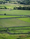 Hilly landscape in the Peak District in the UK with stone fences