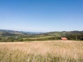 Hilly landscape with scattered houses on Manjaca mountain near Banja Luka