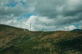 Hilly landscape and several wind generators of electric power