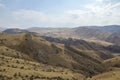 Hilly relief, mountain slopes with sparse vegetation of autumn Caucasus mountains in Armenia Royalty Free Stock Photo