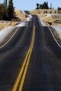 Hilly Road Transportation and Travel Double Yellow Lines Roadway Royalty Free Stock Photo