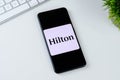 Hilton Honors app logo on a smartphone screen.