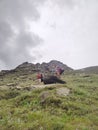 Himachal, India - July 10th, 2022 : Man with trekking bag in the mountain, summer hike with backpacks, himalayan view