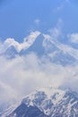 Himalaya Machapuchare mountain peak in cloudy blue sky, Nepal Royalty Free Stock Photo
