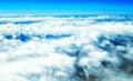 Aerial view of mountains and clouds on top Royalty Free Stock Photo