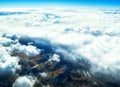 Aerial view of mountains and clouds on top Royalty Free Stock Photo