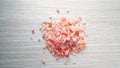 Himalaya pink salt on white wooden table Royalty Free Stock Photo