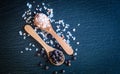 Himalaya pink sea salt and black pepper in wooden spoon, close view Royalty Free Stock Photo