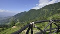 Himalayan Mountain Range with Wooden Railing and Blue sky and Clouds