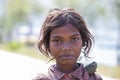 Poor nepalese girl on the street in a Himalayan village, Nepal