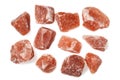 Himalayan pink rock salt against white background.