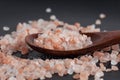 Himalayan pink rock salt in wooden spoon Royalty Free Stock Photo