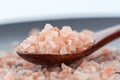 Himalayan pink rock salt in wooden spoon Royalty Free Stock Photo