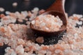 Himalayan pink rock salt in wooden spoon Royalty Free Stock Photo