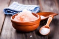 himalayan pink salt in a bowl with a toothbrush