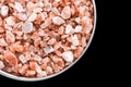 Himalayan salt cristals seeds in pot with copy space