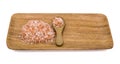 Himalayan salt that is grinded into a small grain, and a number in a wooden spoon, and a pad of wood, on a white background Royalty Free Stock Photo