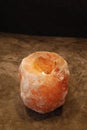 Himalayan Salt Lamp Candle Lit on natural background