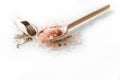 Himalayan salt and pepper on the wooden spoons and white background Royalty Free Stock Photo