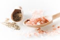 Himalayan salt and pepper on the wooden spoons and white table Royalty Free Stock Photo
