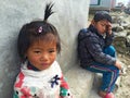 Portrait nepalese children near their house, on the street in Himalayan village, Nepal