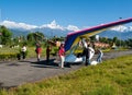 HIMALAYAS, POKHARA, NEPAL. 28 September 2008: Foreign tourist prepares for flight on a hang glider deltaplan.