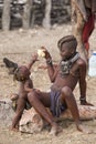 Himba girl and baby