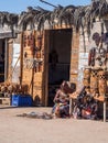 Himba woman sells souvenirs in Walvis Bay, Namibia