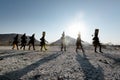 Himba women walking back after collecting water in containers on their heads, Epupa, Kunene Region, Namibia.